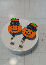 Load and play video in Gallery viewer, Halloween Cat Pumpkin badge reel
